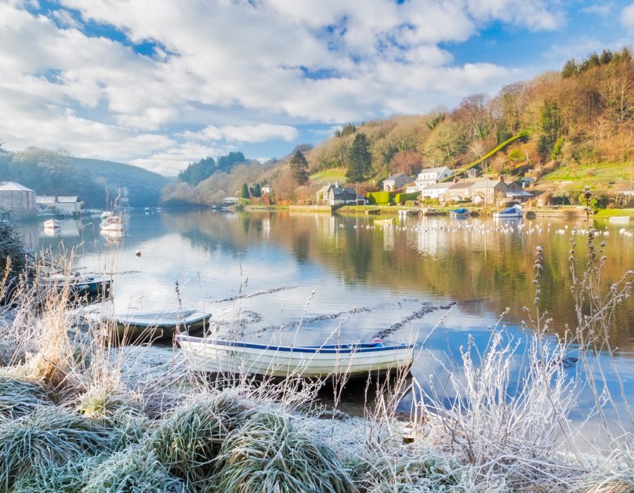 Stunning winters scene of Reflections in the River Lerryn Cornwall on a frosty morining.